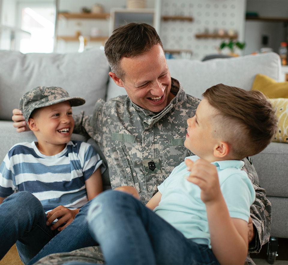 Happy soldier with his boys after his depression treatment