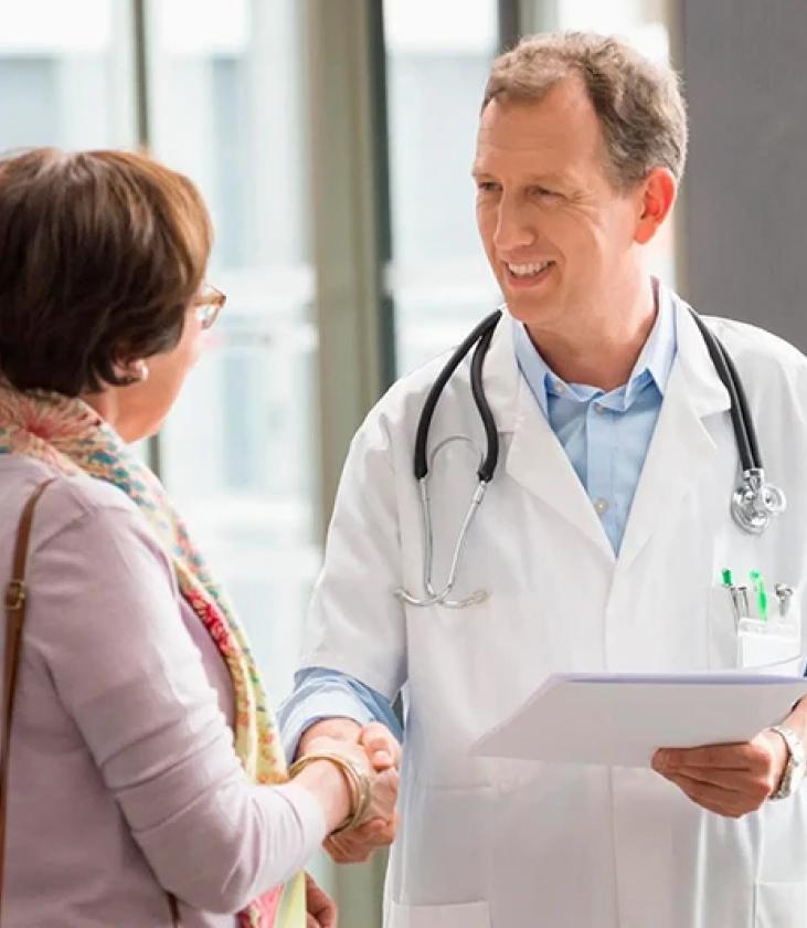 Woman shaking hands with a doctor after a consultation for cognitive performance