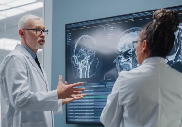 doctors reviewing brain scans as part of mental health treatment