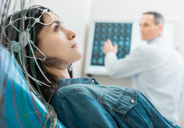 Woman receiving a qEEG as part of her Initial Analysis